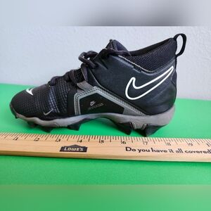 2.5Y Nike Alpha Menace 3 Shark football cleats in black with white accents.
